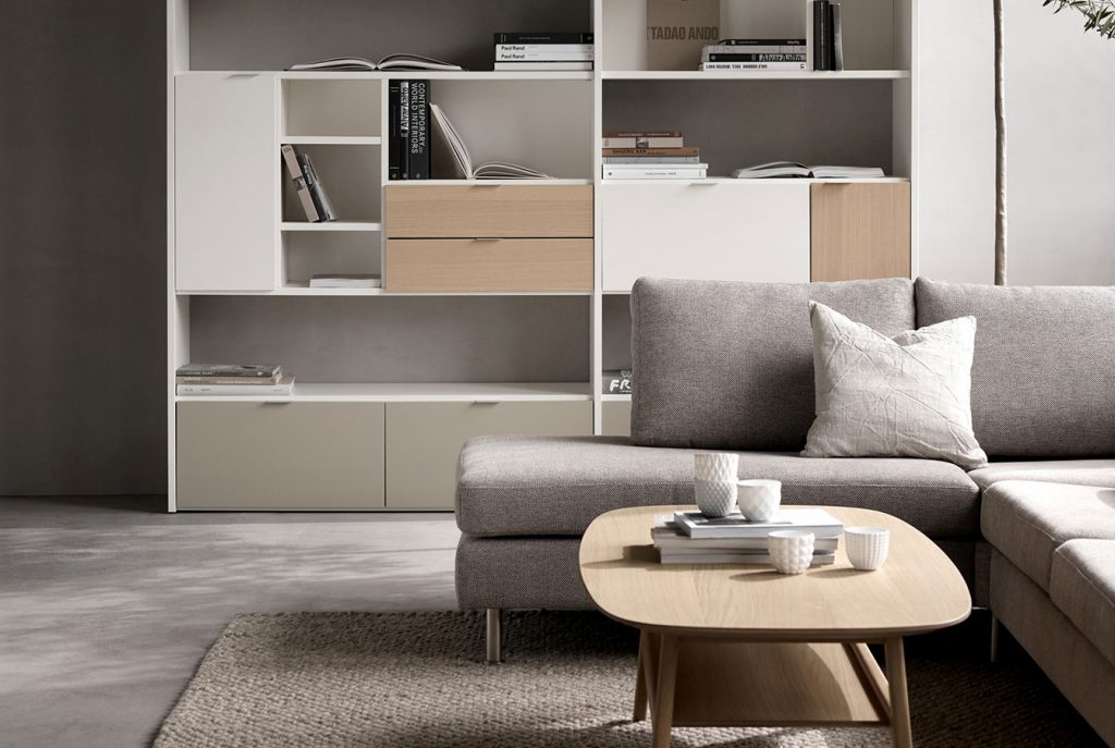 Grey sofa with wooden coffee table and shelves